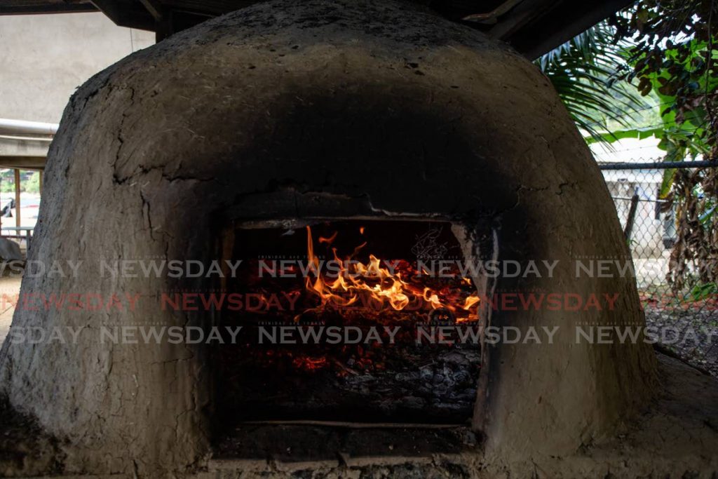 The Taylor Dirt Oven in Castara being heated in preparation for baking bread and other pastries - File Photo