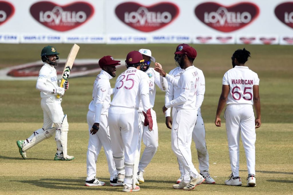 West Indies' players celebrate after the dismissal of Bangladesh's captain Mominul Haque (L) during the first day of the first Test match against Bangladesh at the Zohur Ahmed Chowdhury Stadium in Chittagong on Wednesday. (AFP PHOTO - 