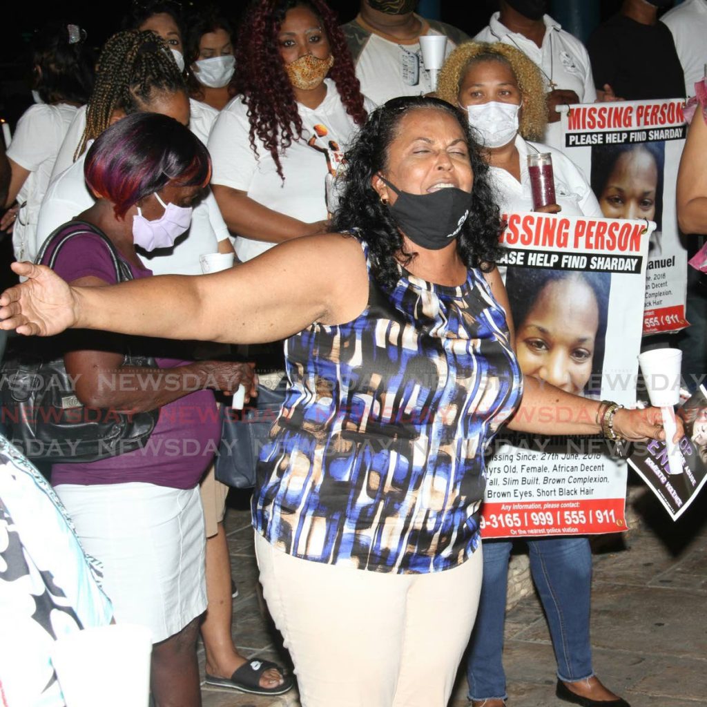 In this file photo, Flora Singh prays during a vigil for Andrea Bharatt, at the Arima Lay-By. The event was hosted by the UNC's Women's arm. - Angelo Marcelle