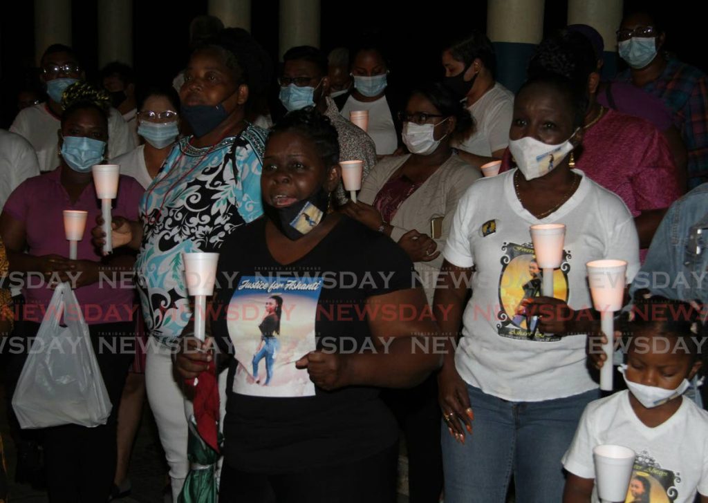 Relatives of murdered teenager Ashanti Riley speak at a candlelight vigil on Wednesday praying for the safe return of Andrea Bharatt who was reported missing. Bharatt was later found murdered in the Heights of Aripo. - Angelo Marcelle