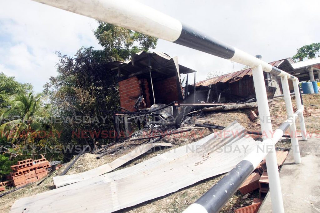 The burnt remains if the home of Shae Gobin of Cotton Hill road, Mayo who was last seen with 14 year old Michael Sooknanan who was later found electrocuted on the grounds of the Guaracara refinery where they went to steal copper.


Photo: Lincoln Holder  