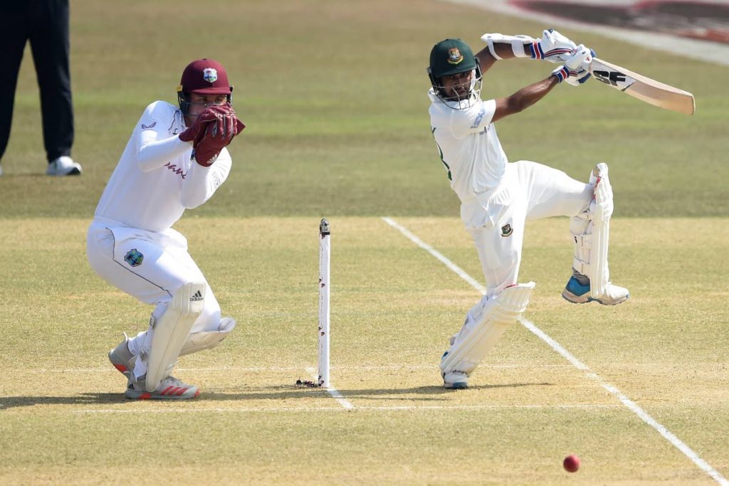 Bangladesh's Mehidy Hasan Miraz (R) plays a shot during the second day of the first Test match between Bangladesh and West Indies at the Zohur Ahmed Chowdhury Stadium in Chittagong on Thursday. - (AFP PHOTO)