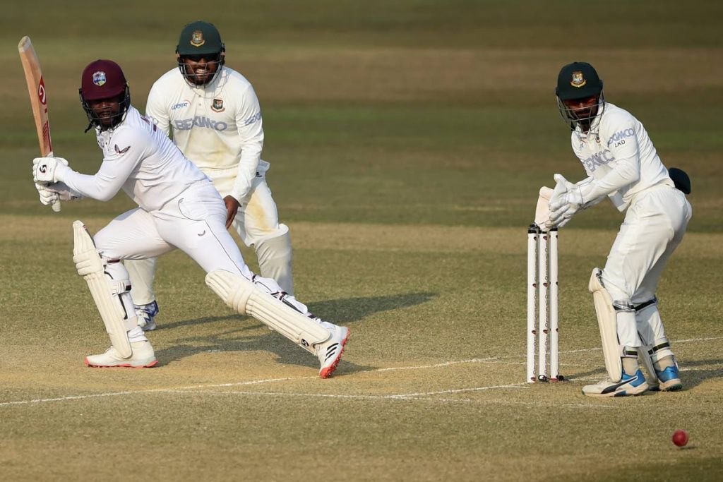 West Indies' Kyle Mayers (L) plays a shot during the fourth day of the first cricket Test match between Bangladesh and West Indies at the Zohur Ahmed Chowdhury Stadium in Chittagong on Saturday.  - (AFP PHOTO)