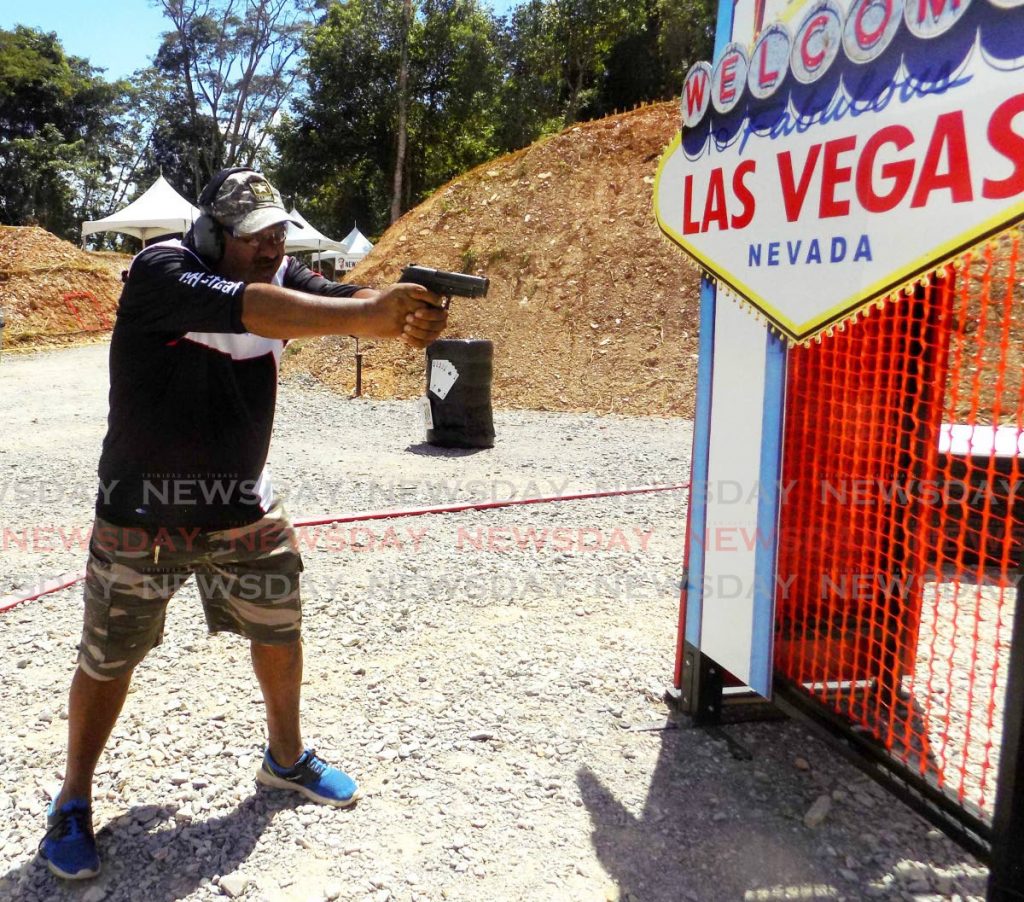 Field safety officer Nawaz Karim demonstrates the proper shooting stance at a Las Vegas-themed obstacle course for the MG Tactical World Shoot competition in Chaguaramas on Sunday. 
 - Shane Superville