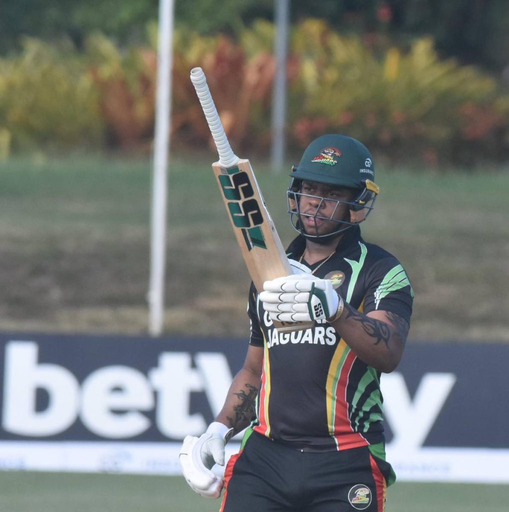 Guyana Jaguars batsman Shimron Hetmyer raises his bat after completing his half century against Barbados Pride, on Monday. PHOTO BY CWI MEDIA - CWI MEDIA