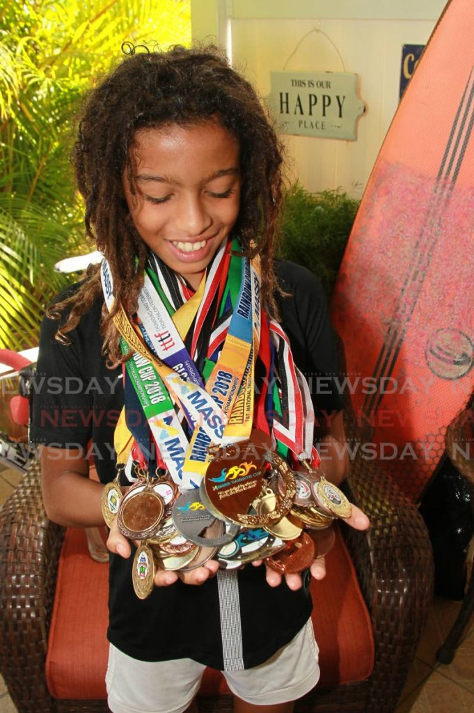 Gabre Kambon has won medals for 10 sports, from surfing to triathlons. PHOTOS BY ROGER JACOB - 
