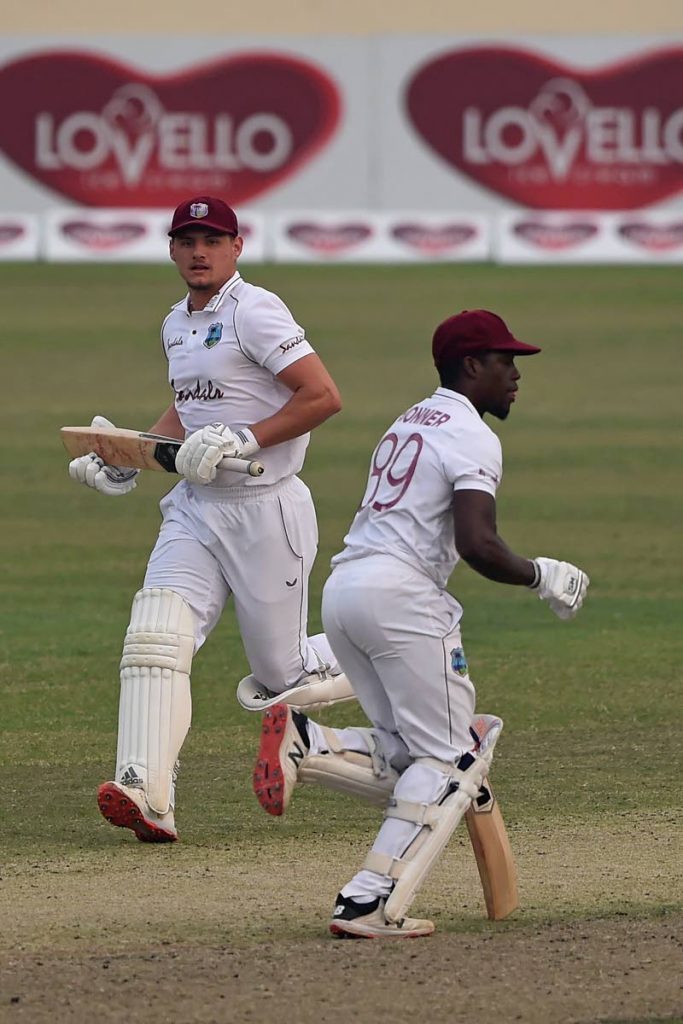 West Indies' Joshua Da Silva (R) and Nkrumah Bonner run between the wickets during the first day of the second Test against Bangladesh at the Sher-e-Bangla National Cricket Stadium in Dhaka, on Thursday.  - (AFP PHOTO)