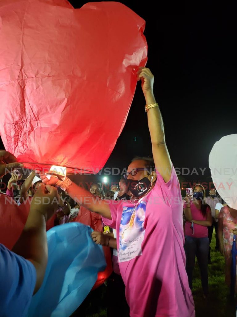 Randolph Bharatt releases a lantern in memory of his slain daughter Andrea at Eddie Hart Grounds, Tacarigua on Friday night. PHOTO BY ROGER JACOB - 