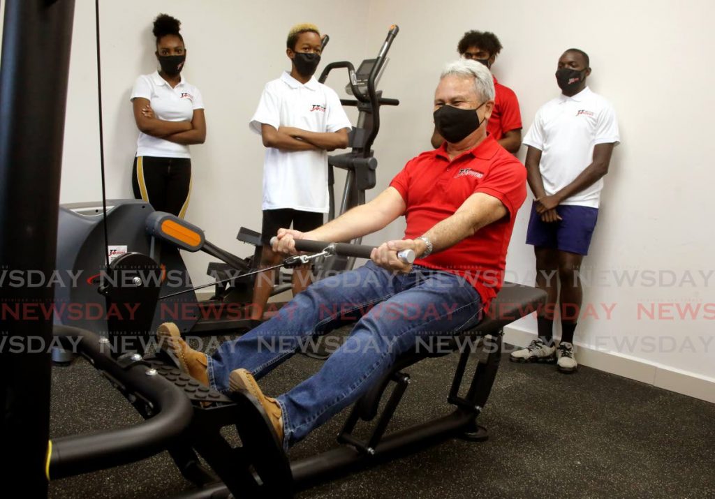 Finance Minister Colm Imbert exercises in a new gym at the Bagatelle Community Centre, Diego Martin during the launch of the Healthy Youth TT Communities Programme on Saturday. PHOTOS BY SUREASH CHOLAI - 
