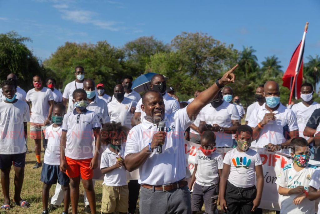 Michael Stewart, executive director at Communication Consultant Tobago Ltd addresses the Tobago Men Making a Difference rally at Store Bay, Crown Point, Tobago on Saturday. PHOTO BY DAVID REID - 