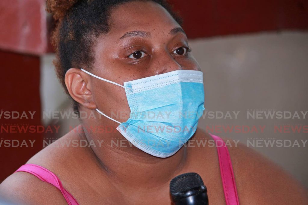 Nneka McNeil Greene speaks to the media after her family home  on St Vincent Street, San Fernando, was destroyed by fire early Sunday morning. PHOTO BY CHEQUANA WHEELER  - 