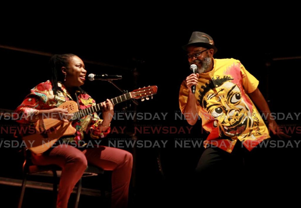 David Bereaux sings vintage calypsoes during the Kaiso segment, accompanied by musician Marva Newton, in the Carnival play MAS at the National Academy for the Performing Arts, Port of Spain on Carnival Monday (February 15). - 