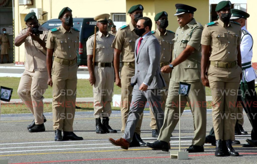 National Security Minister Stuart Young, centre, inspects the Prison Service passing out parade and induction ceremony of 239 recruits at the Golden Grove Compound in Arouca on Tuesday. PHOTO BY SUREASH CHOLAI - 
