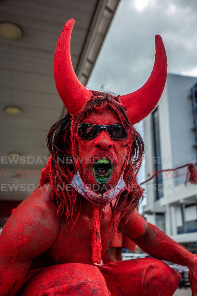 GROWL: A red devil growls at Newsday Chief Photographer Jeff Mayers at KFC's Taste of Carnival promotion held at the front of the fastfood outlet's Independence Square, Port of Spain branch.  - 