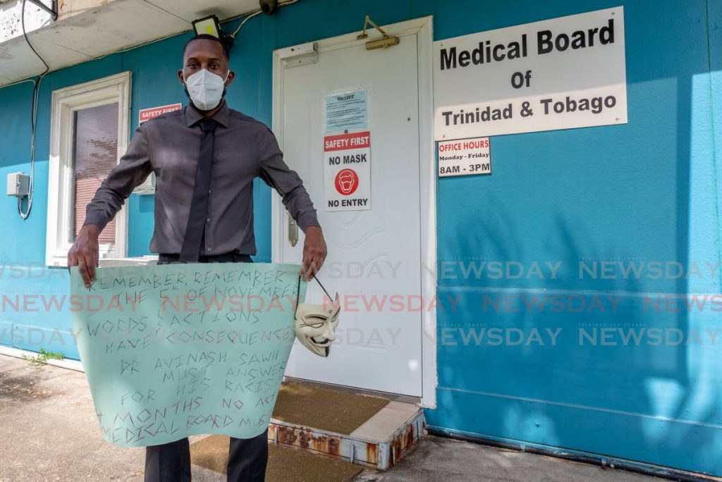 ONE-MAN JOB: Dr Andre Alleyne protests outside the office of the Medical Board at Mt Hope on Thursday. - Jeff Mayers