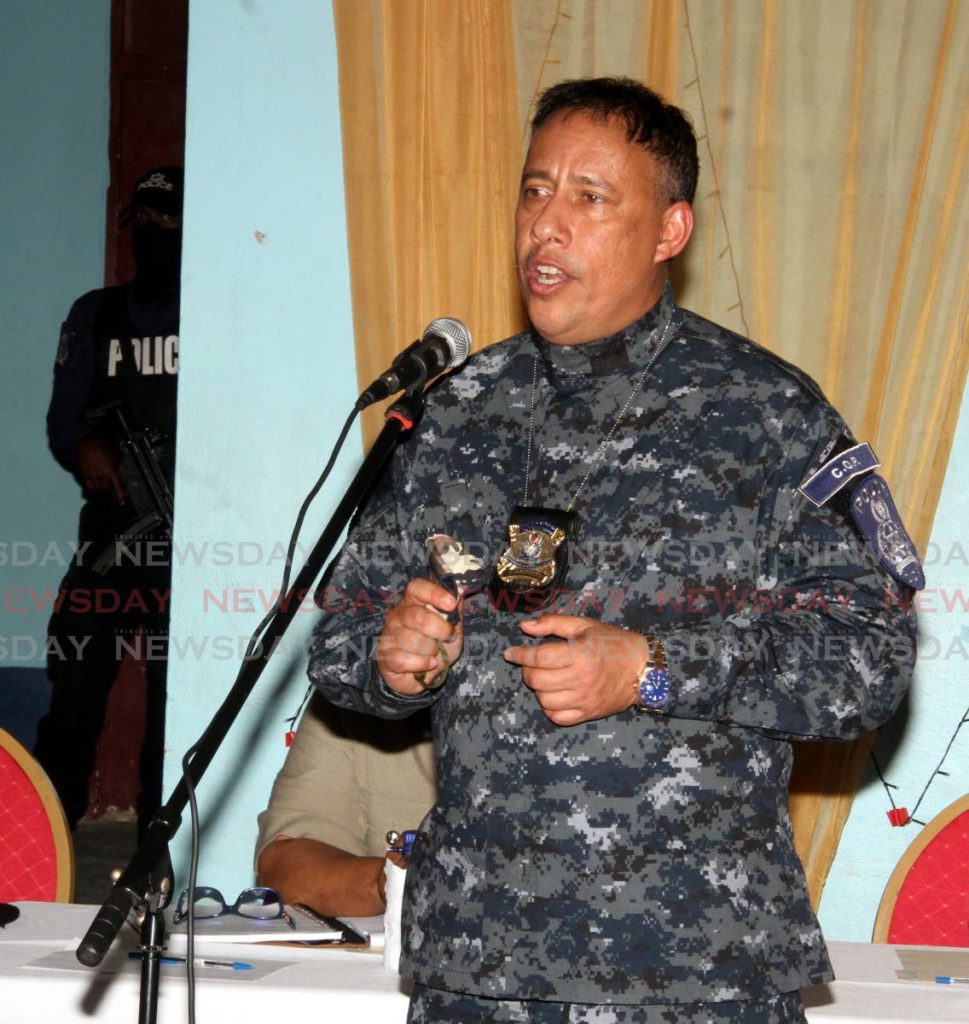Police Commissioner Gary Griffith responds to concerns of Santa Rosa Heights, Arima residents at a community meeting held at the Santa Rosa Primary School on Thursday. - Angelo Marcelle