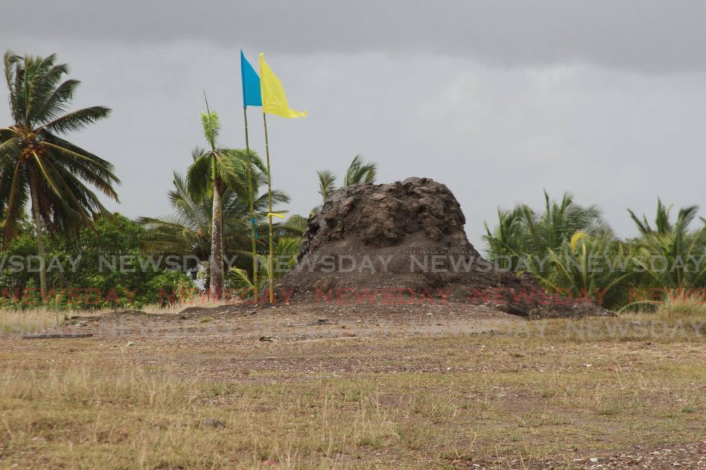 Flags planted after a prayer service at the Piparo mud volcano. - File photo by Marvin Hamilton