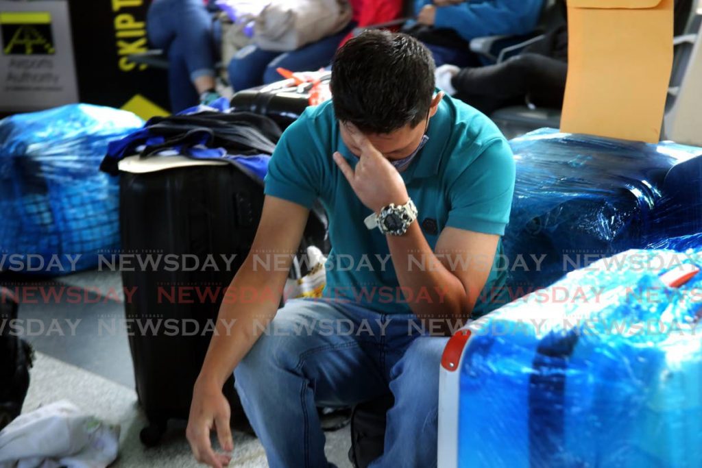 A Venezuelan at Piarco International Airport on Thursday ponders his next move after learning that his repatriation flight had been cancelled. - Sureash Cholai