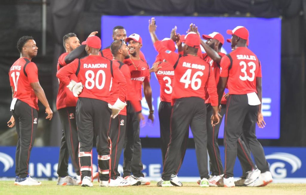 In this February 27 file photo, TT Red Force players 
celebrate after beating the Guyana Jaguars by 152 runs in the CG Insurance Regional Super50 tournament final, at Coolidge Cricket Ground, Antigua. - CWI Media