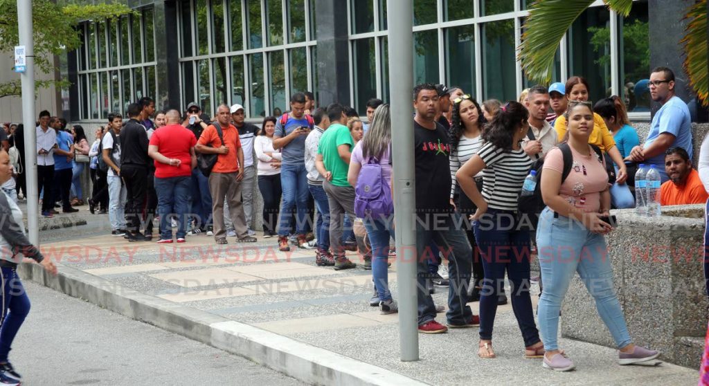 In this file photo, Venezuelans line up outside the Ministry of National of Security during the initial registration exercise in 2019. - 