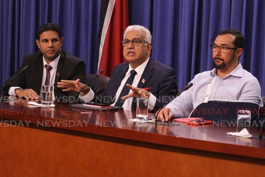 Chief Medical Officer Dr Roshan Parasam, from left, Health Minister Terrence Deyalsingh and National Security Minister Stuart Young during a media conference at the Diplomatic Centre, St Ann's on March 12, 2020. TT's first covid19 case was reported on that day. PHOTO BY AYANNA KINSALE - 