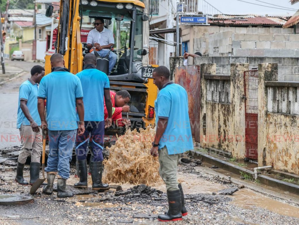 In this file photo, WASA workers on the job in Belmont repairing a broken water main. - Jeff Mayers