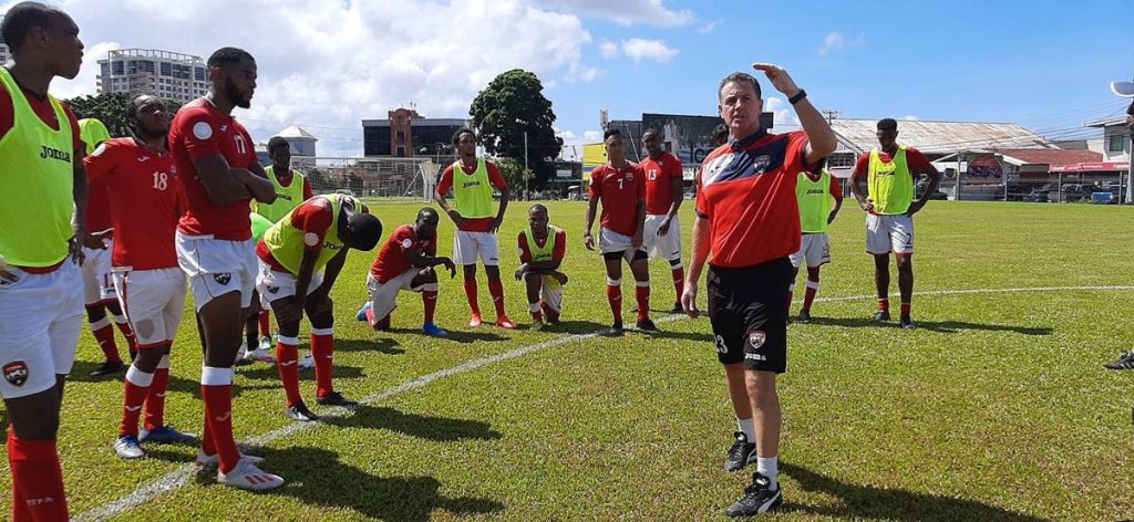 In this  Nov 11, 2020 file photo national football coach Terry Fenwick talks to his players during a training session at Police Barracks, St James.   - TTFA Media