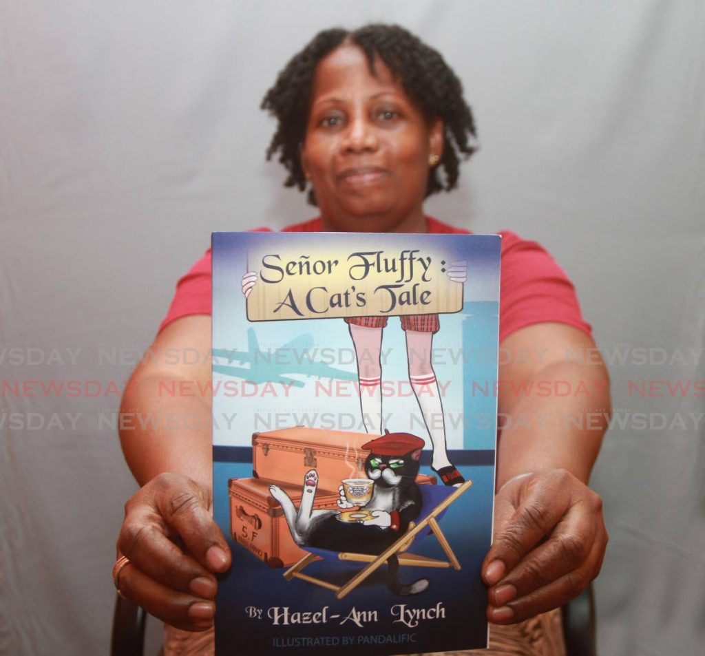 Hazel-Ann Lynch with her book Senor Fluffy: A Cat's Tale, which is a combination of humour, action, and adventure from a cat's eyes. - Marvin Hamilton