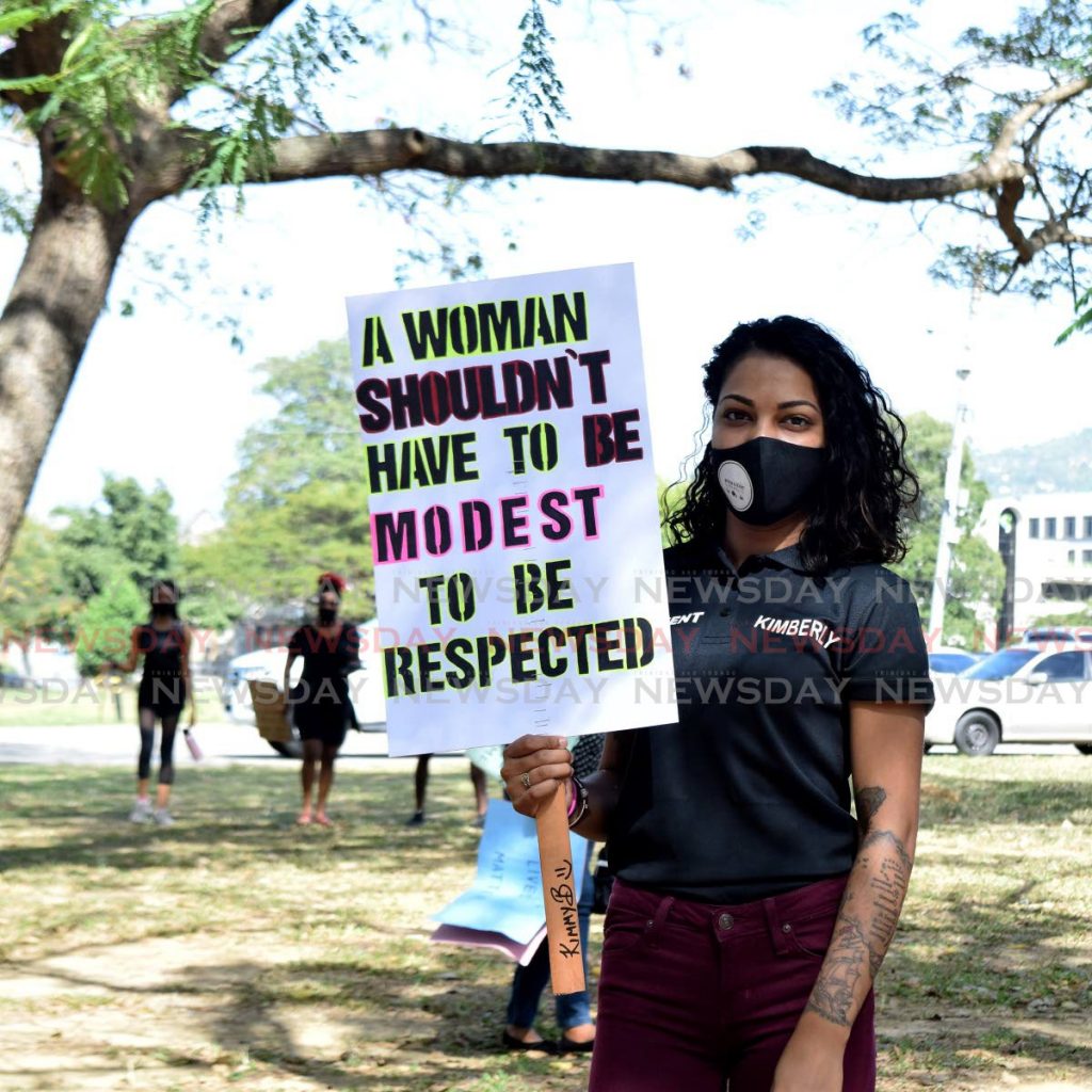 A young woman protests the violence against women and girls at the Queen's Park Savannah. PHOTO BY VIDYA THURAB 