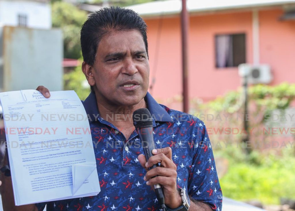 Oropouche East MP Dr Roodal Moonilal holds the pre-action protocol letter he received from former attorney general John Jeremie for comments about a CCTV contract. Moonilal spoke to the media in Debe on Saturday. Photo by Jeff K Mayers