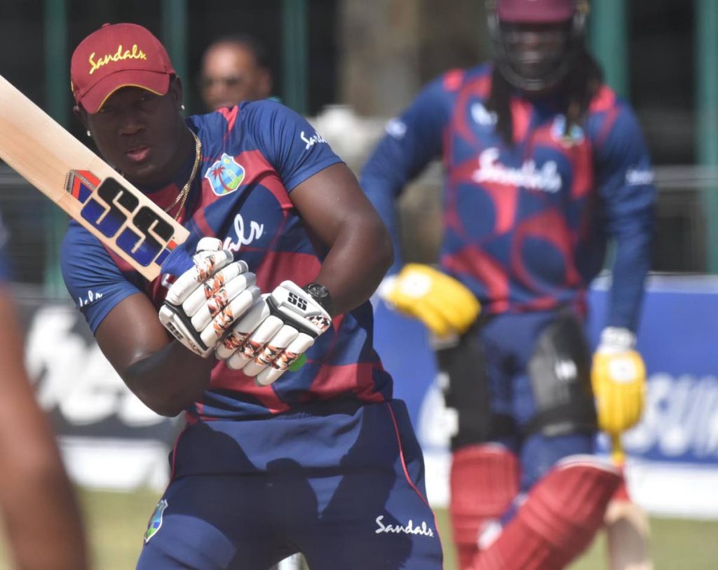 West Indies’ Rovman Powell takes part in a team training session on the eve of the first Twenty20 against Sri Lanka, in Antigua , on Wednesday. Looking on, at right, is veteran Chris Gayle.  - CWI Media