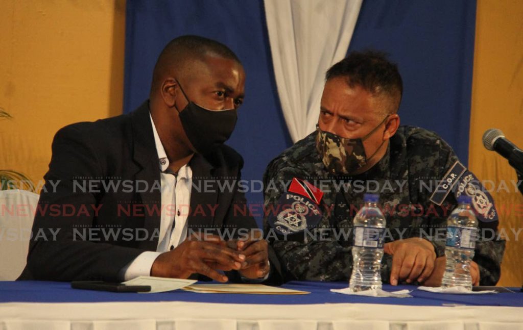 La Horquetta/Talparo MP Foster Cummings, on left and CoP Gary Griffith, chat at the La Horquetta/Talparo Constituency  Community Town Meeting, at the La Horquetta Regional Complex on Wednesday. - Angelo Marcelle