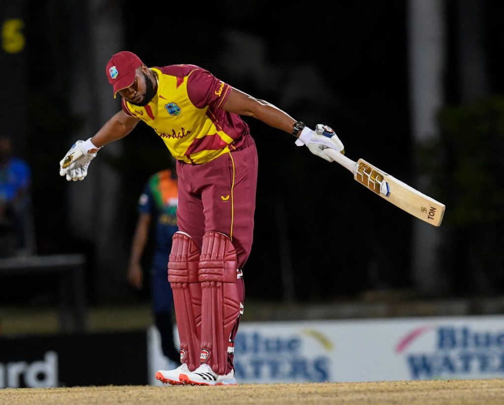 Kieron Pollard of West Indies celebrates hitting six sixes off Akila Dananjaya of Sri Lanka during a T20i match between Sri Lanka and West Indies at Coolidge Cricket Ground on Wednesday in Osbourn, Antigua.   AFP PHOTO - 