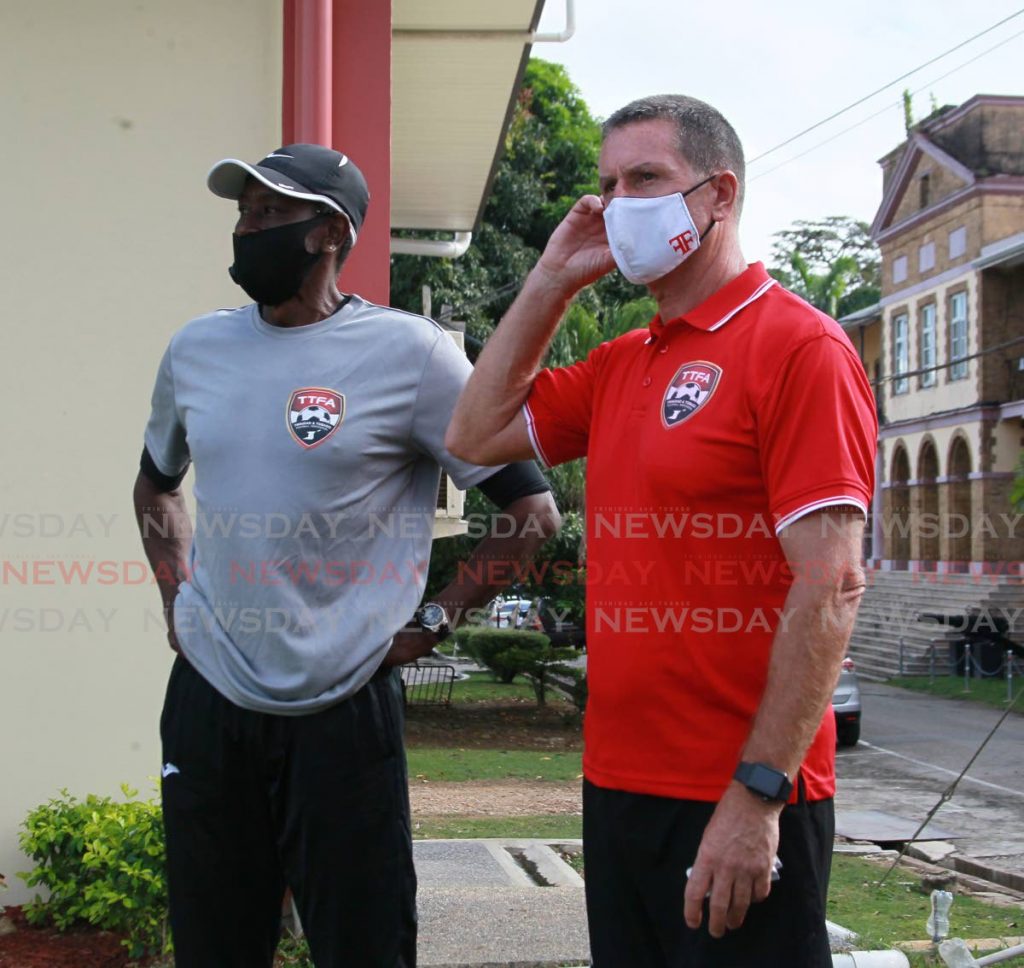 TT senior men’s football team head coach Terry Fenwick, right, and trainer Oswald Birchwood during a training session and luncheon, at the Police Barracks, St James, on Friday.  - ROGER JACOB