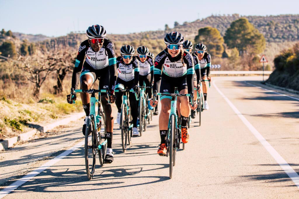 Trinidad and Tobago's Teniel Campbell, left, with her new women's pro Team BikeExchange teammates in Spain.  - GreenEDGE Cycling