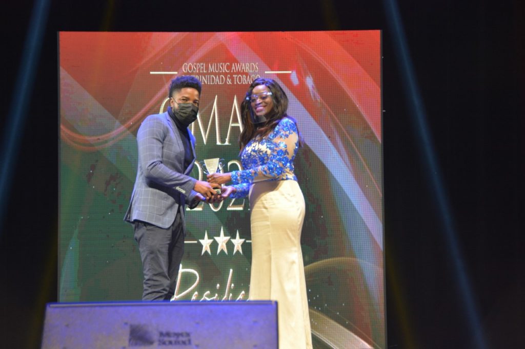 Minister of Social Development and Family Services Donna Cox presents the resilience award to Cristan “Soundmind” Daniel at the Gospel Music Awards of TT at Queen's Hall, St Ann's on Sunday. 

Photo courtesy Ministry of Social Development and Family Services