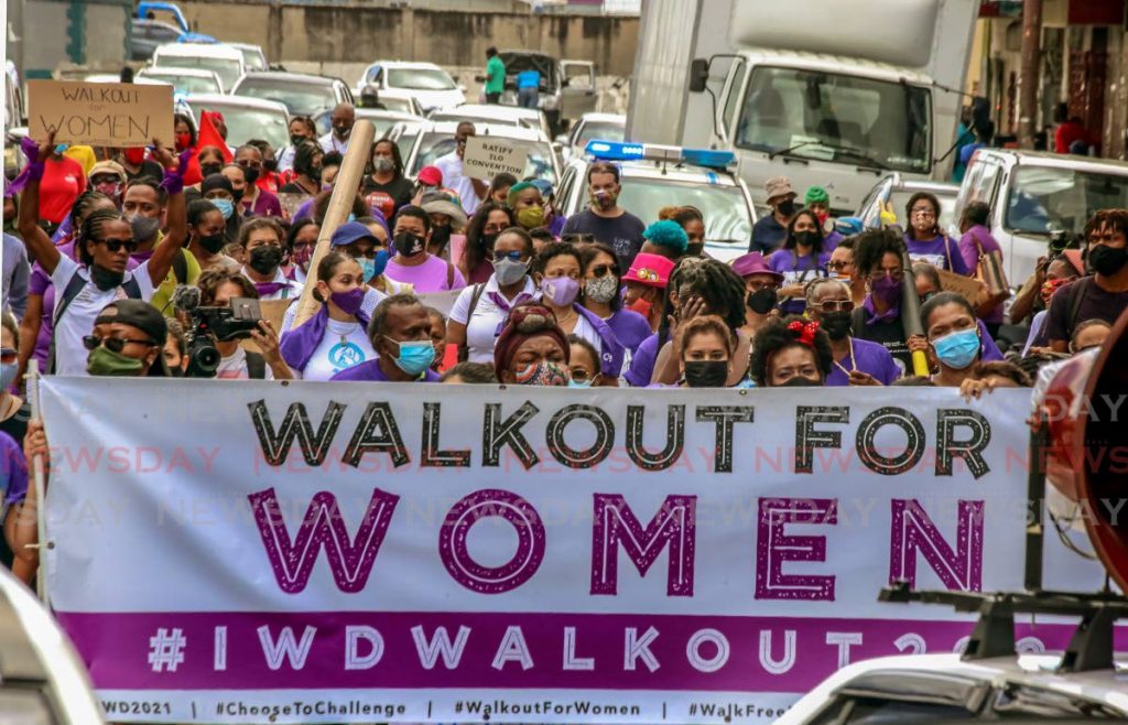 People came together for the International Women's Day march in Port of Spain. Photos by Sureash Cholai