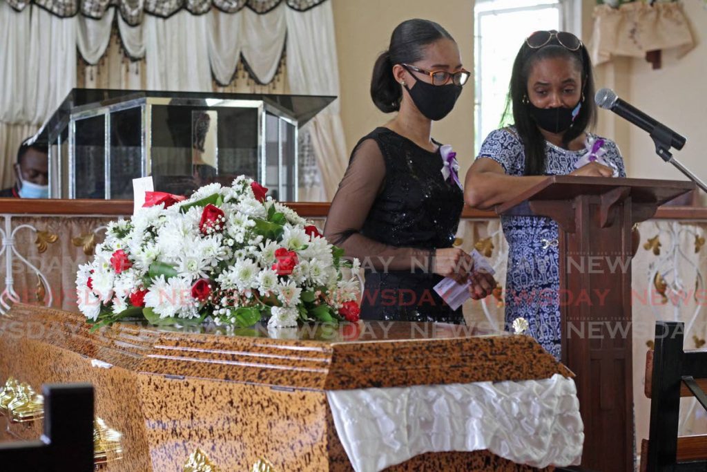Camille Molineau reads the eulogy at the Independent Baptiste Church on Monday evening at the funeral service for her mother Karen Johanna Rauseo, the body was found March 5 at a house in Buen Intento, Princes Town. - Marvin Hamilton