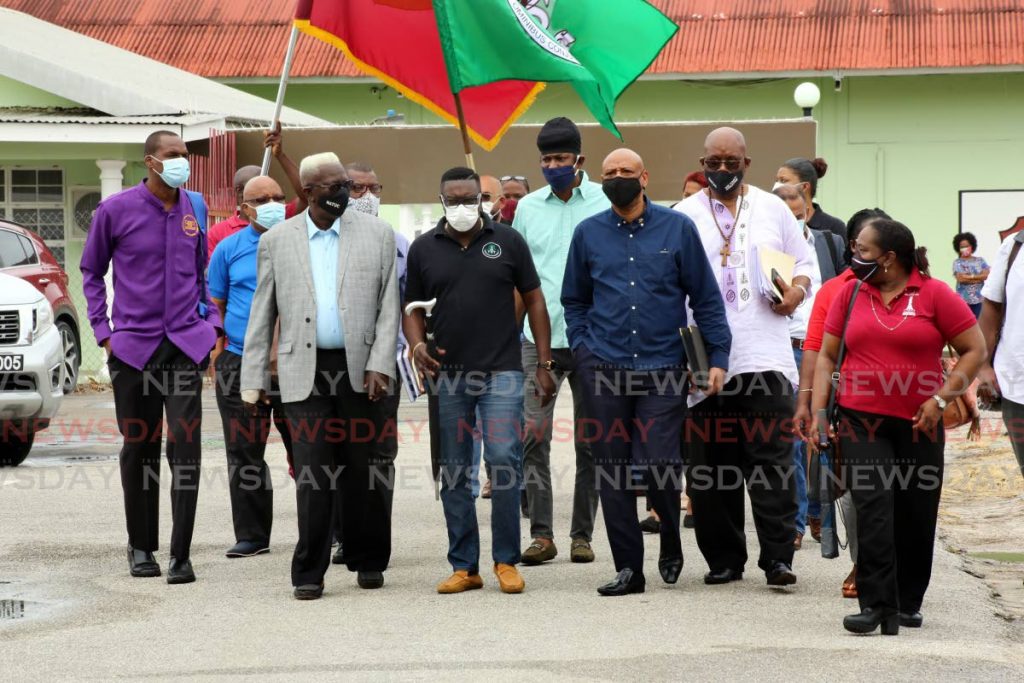 Trade union leaders emerge after a meeting to discuss their exit from the National Tripartite Advisory Council last week in Port of Spain. - SUREASH CHOLAI