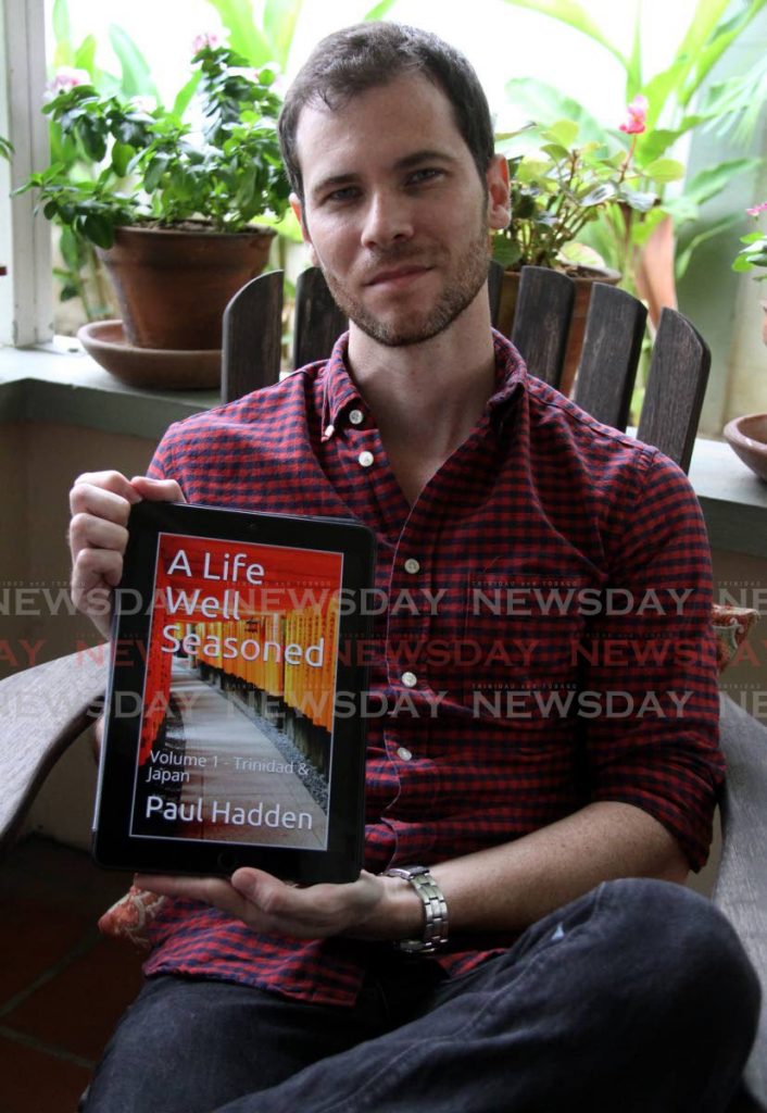  Paul Hadden with a copy of A Life Well Seasoned: Volume 1 – Trinidad and Japan, a collection his columns in Sunday Newsday's WMN magazine. Photo by Angelo Marcelle - Photo by Angelo Marcelle