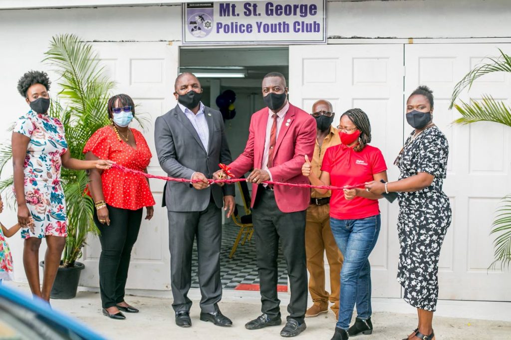 Bacolet/Mt St George electoral representative Joel Jack, centre left, and Mt St George Police Youth Club head Cpl Larry Brathwaite cut the ribbon at the newly refurbished Mt St George Police Youth Club. 
 - 