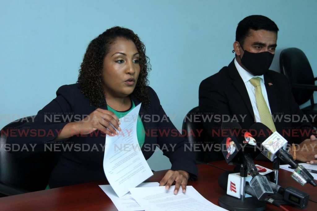 Tabaquite MP Anita Haynes speaks to media at a press conference held at the Office of the Leader of the Opposition on Charles Street, Port of Spain on Sunday as Oropouche West MP Davendranath Tancoo looks on.  - Angelo Marcelle