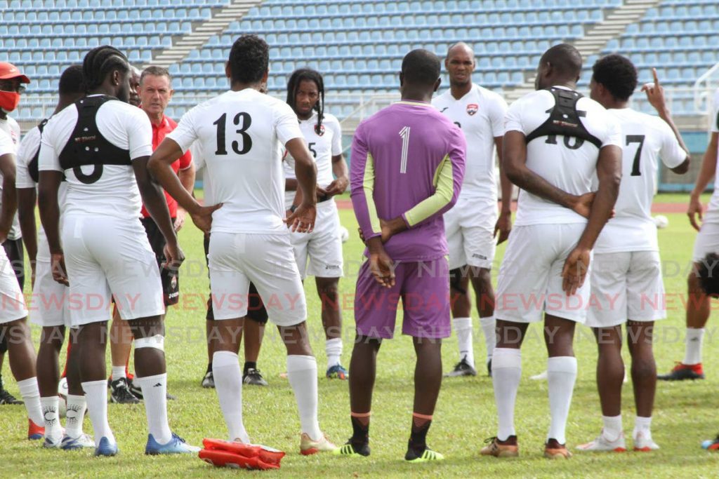 Trinidad and Tobago men's football coach Terry Fenwick chats with players during a training session on Wednesday at the Ato Boldon Stadium, Couva. PHOTO BY MARVIN HAMILTON - 