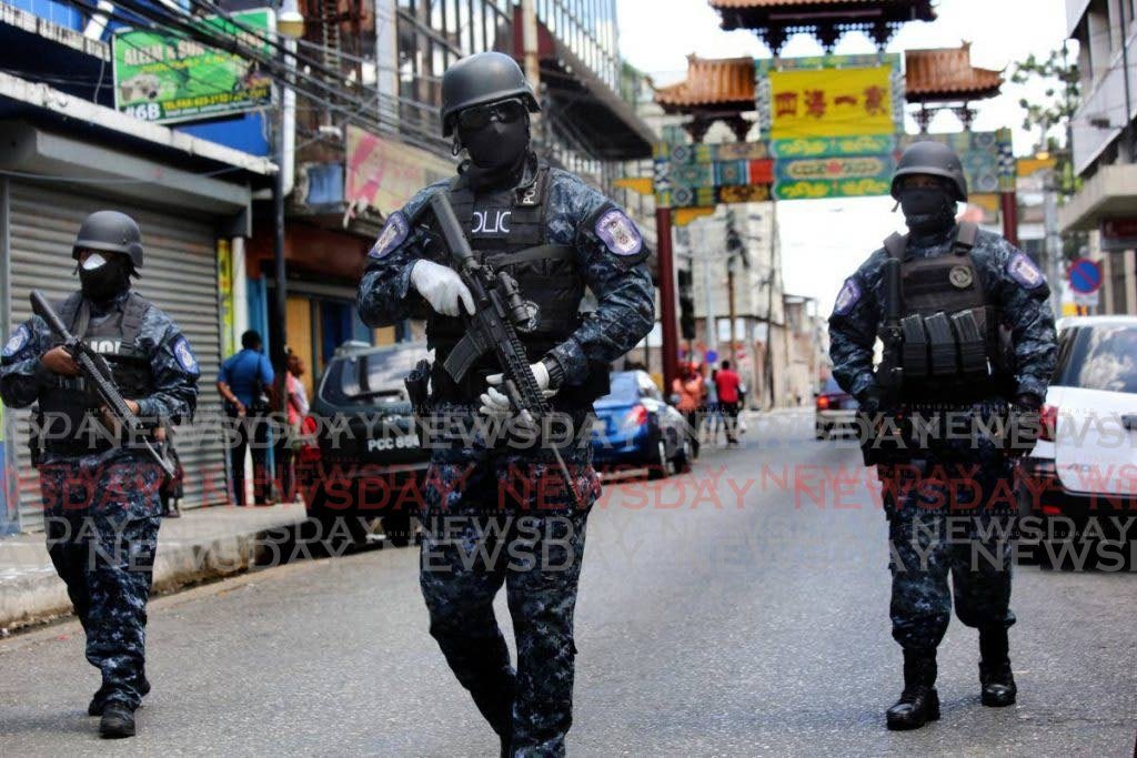 Guard and Emergency officers patrol Charlotte St, Port of Spain, during the covid19 lockdown to ensure people adhered to the restrictions. PHOTO BY SUREASH CHOLAI - 