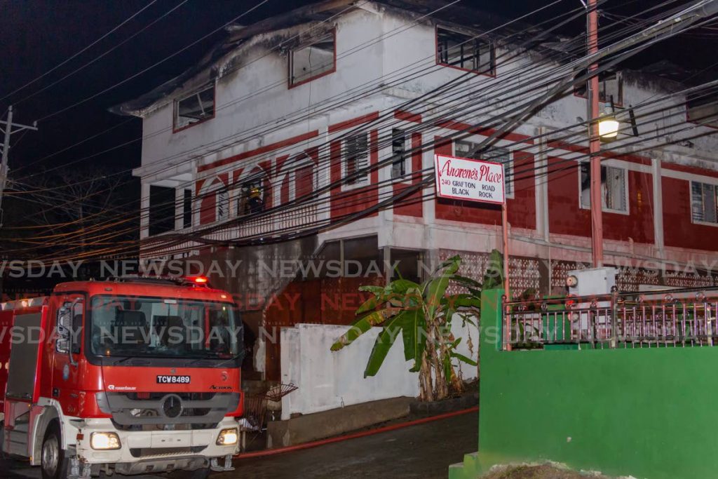 The top floor of a building located at Black Rock, Tobago, owned by prominent business owner Christopher Roberts, was gutted by fire while fire officers saved the two bottom floors on Wednesday night. - Photo by David Reid