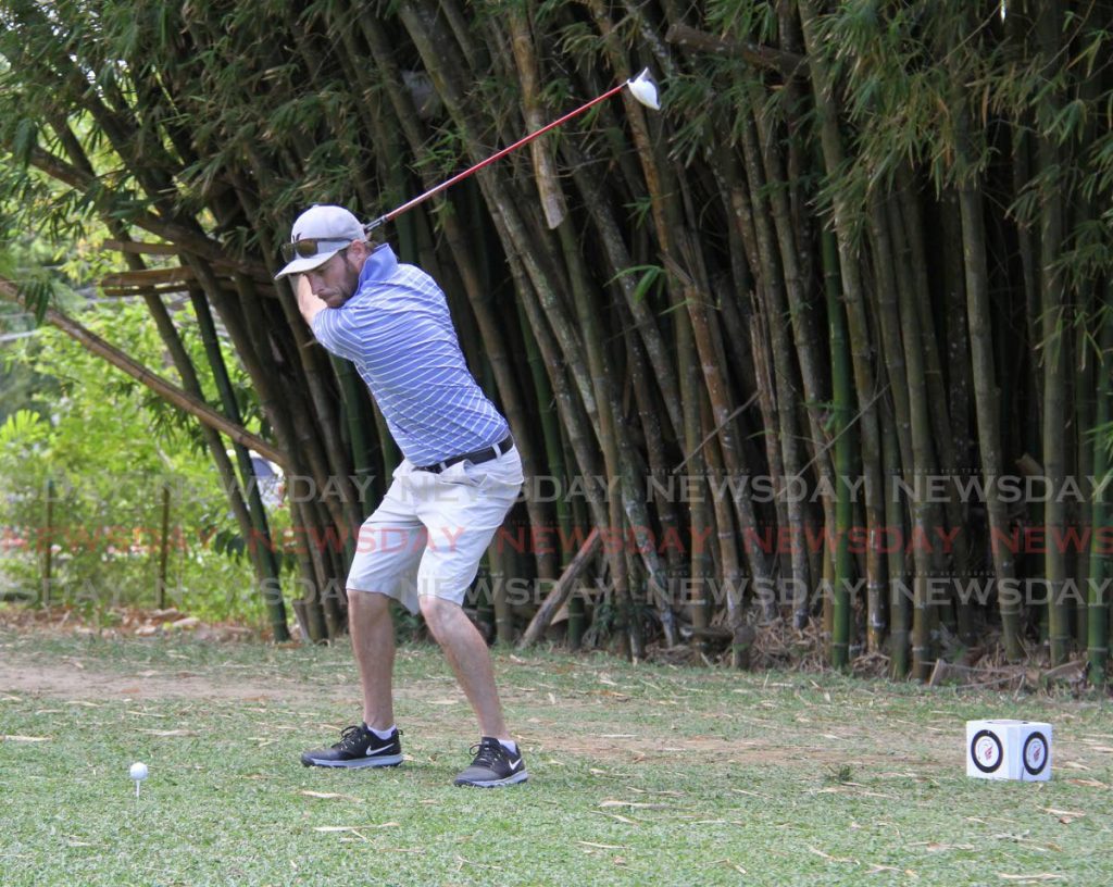 Golfer Simon Merry is about to drive his ball on the ninth hole at the TT Open Golf tournament at St Andrew’s Golf Club in Moka, Maraval, on Thursday.  - Angelo Marcelle