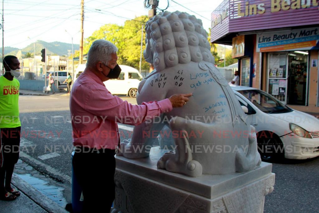 Joel Martinez, Mayor of Port of Spain visits the defaced Chinatown monuments, after reports of the graffiti had been made by the public. Photo by Roger Jacob