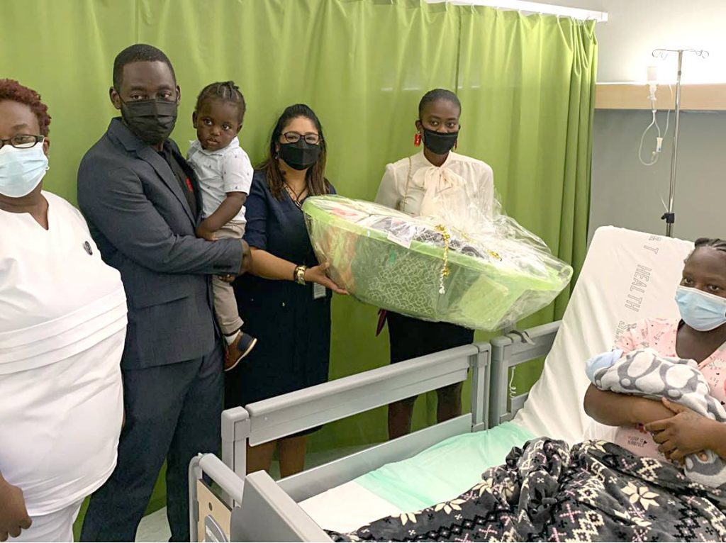 Point Fortin MP Kennedy Richards Jr, second from left, staff at the Point Fortin Hopital and Borough employees, present a hamper to one of four mothers that were among the first to give birth at the new hospital on Wednesday.  Photo courtesy Kennedy Richards Jr's Facebook page