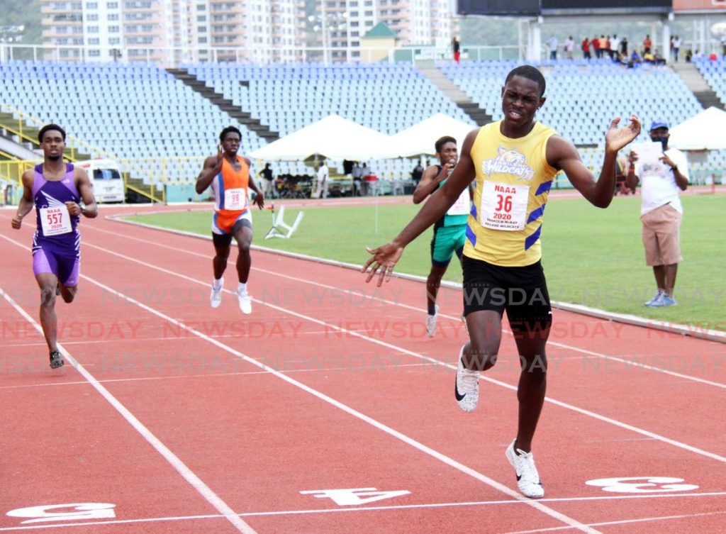 Abilene Wildcats’ Shakeem McKay (R) sprints to gold in the boys’ Under-20 400m, in the NAAA’s track series at the Hasely Crawford Stadium, Port of Spain, on Sunday. Photo by Ayanna Kinsale