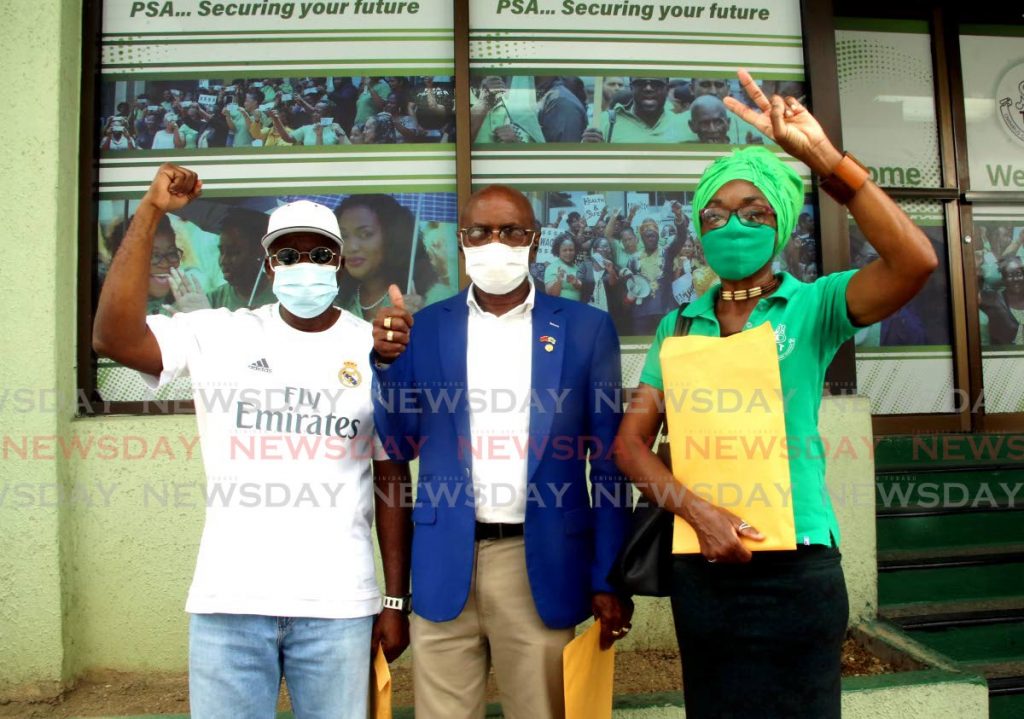 PSA members Jude Davidson (left) and Jennifer Frederick (right) with social activist Wendell Eversley call for the resignation of Public Services Association (PSA) president Watson Duke during a protest outside the PSA office on Abercromby Street, Port of Spain. - Sureash Cholai